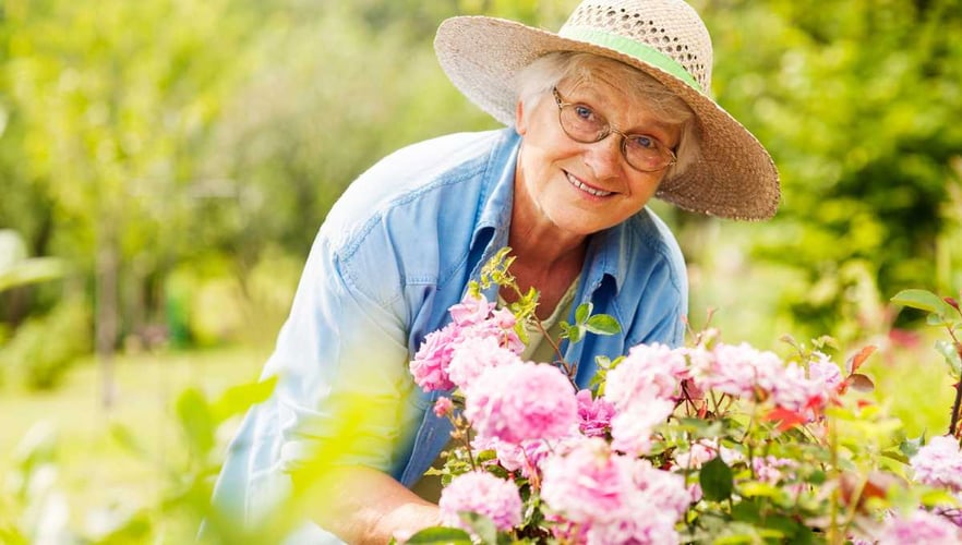 senior woman gardens benefits of nature blog header pacifica senior living